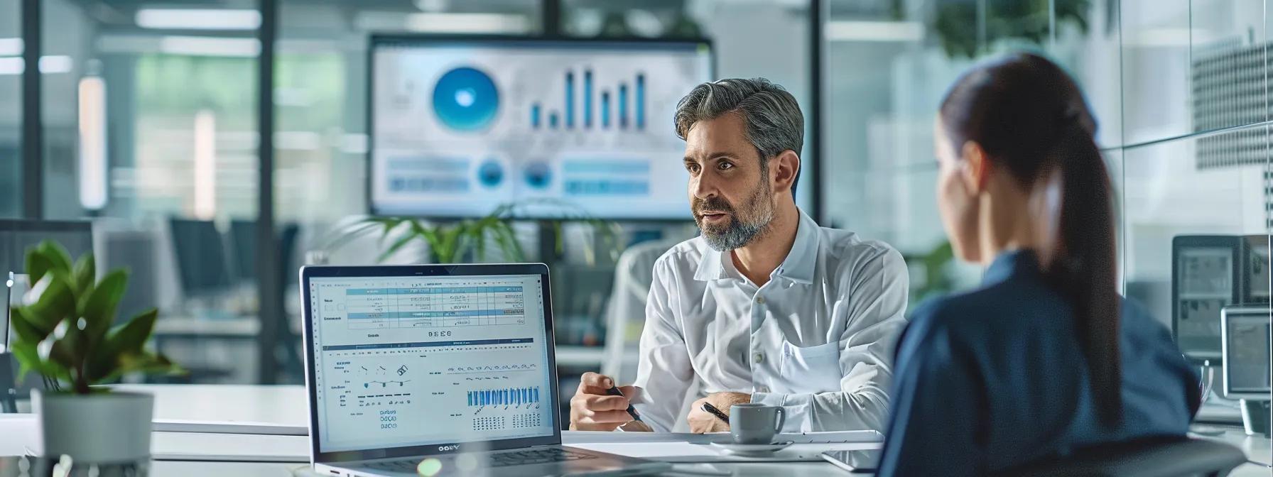 a modern, sleek office setting features a professional discussing moving estimates with a representative, with a laptop open displaying a detailed inventory spreadsheet and transparent pricing charts on the screen.